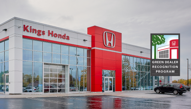 The exterior of a Honda dealership is shown.