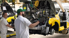 Honda employees put the finishing touches on a vehicle in a manufacturing facility 