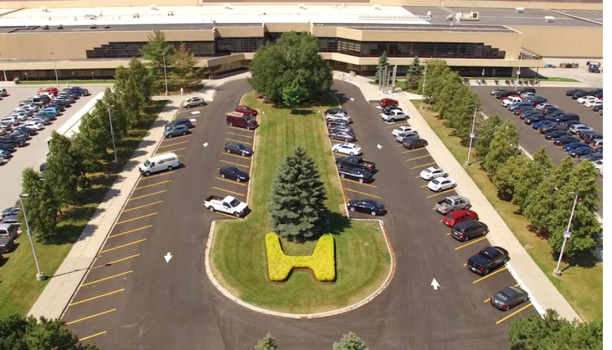 A videoplayer shows an overhead shot of a Honda manufacturing facility. 
