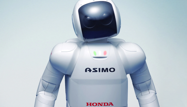 A robot faces the camera against a neutral background. 