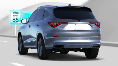 Rear-view image of a Honda SUV on a highway. 