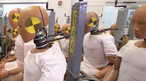 A still image from a video showing a crash-test model is shown.
